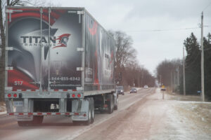 Titan Transline tractor-trailer preparing for a Canada–U.S. cross-border freight shipment.