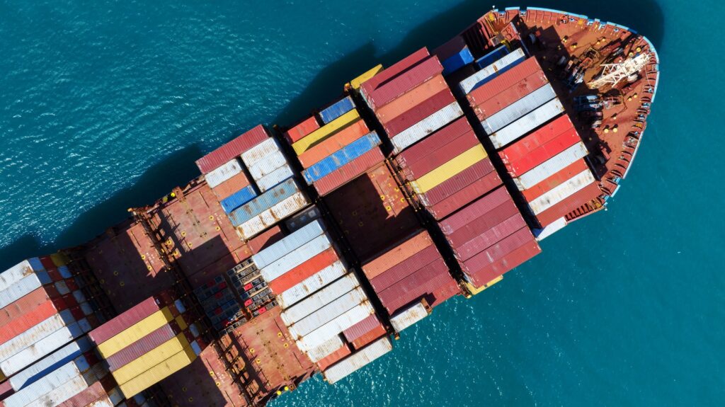 top view Cargo Container ship in the ocean ship carrying container and running for