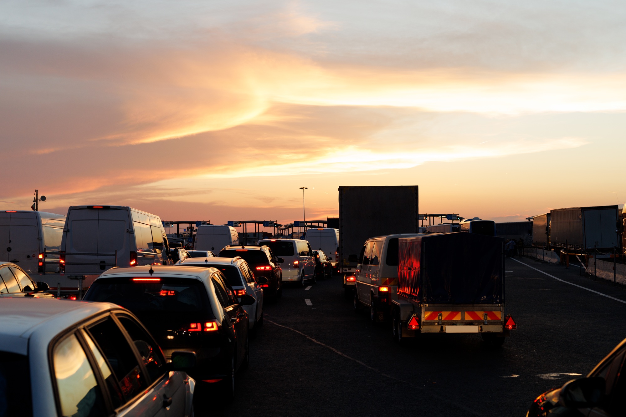 Commercial trucks waiting at the Canada–U.S. border to clear customs.